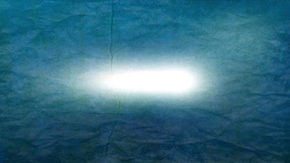 Glowing Light on Textured Blue