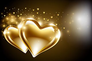 Two Golden Hearts with Shimmering Dust on Dark Background