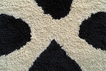 Abstract Black and Beige Wool Rug Texture