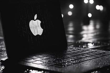 Apple Logo on Laptop in Rain