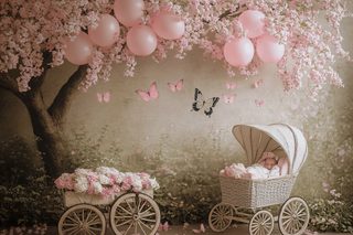 Baby in Vintage Pram with Pink Balloons