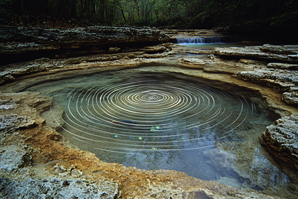 Circular Ripple Pool in Natural Landscape