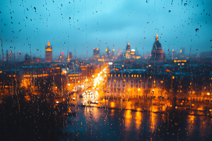 City Lights Through Rain-Streaked Window