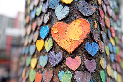 Colorful Hearts on Tree Trunk