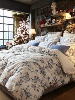 Cozy Bedroom Interior With Floral Bedding