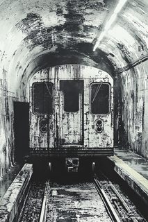 Derelict Subway Train in Dark Tunnel