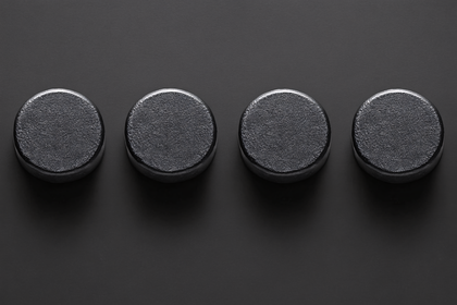 Four Black Cylinders