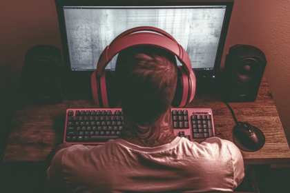 Gamer In Red Headphones