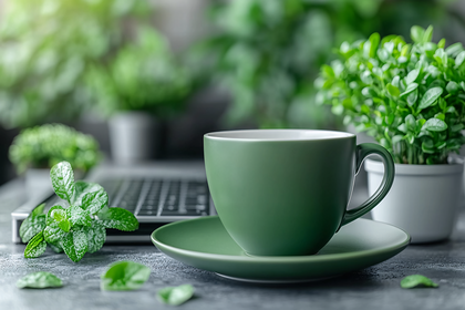 Green Tea Cup On Desk With Plants