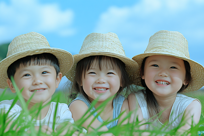 Happy Children in Straw Hats