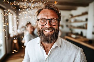 Happy Man with Glasses and Confetti