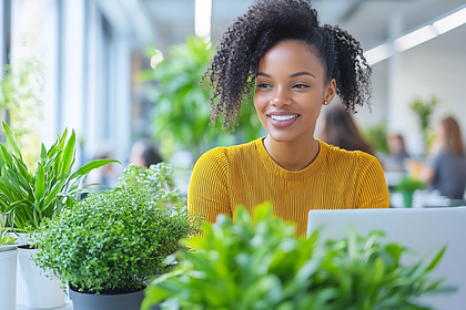 Happy Woman Working in Modern Office with Plants