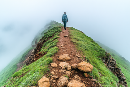 Hiker on Mountain Ridge in Fog