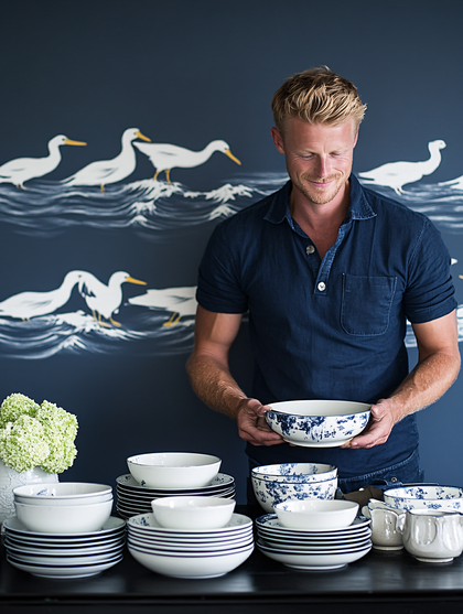 Man Holding Bowl with Tableware
