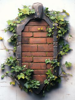 Ornate Brick Wall Decorated With Ivy