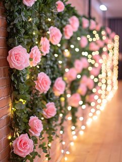 Pink Roses and String Lights on Brick Wall