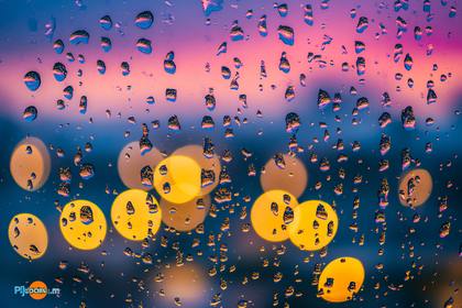 Raindrops on Window with Bokeh Lights