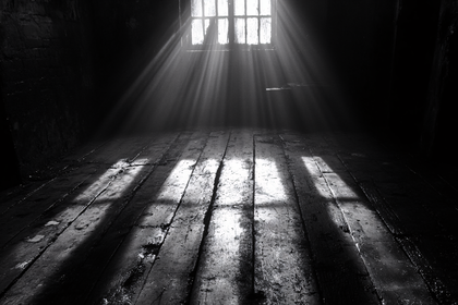 Rays of Light Through Window in Dark Room