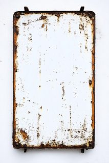 Rusty Metal Sign On White Wall