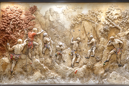 Sculpted Rock Climbers On Mountain Relief