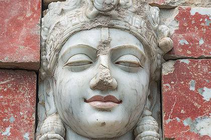 Serene Stone Face Sculpture