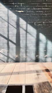 Shadows on Textured Brick Wall