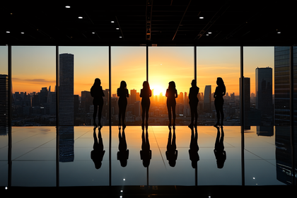 Silhouetted Women Admiring City Sunset
