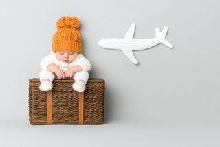 baby on suitcase