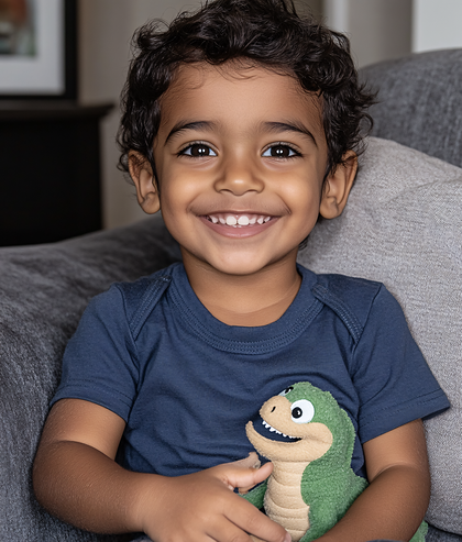 Smiling Boy with Toy Dinosaur