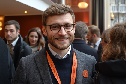 Smiling Man at Conference