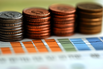 Stacks of Coins and Financial Chart