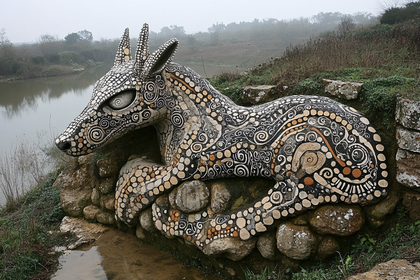 Stone Animal Sculpture by Riverside