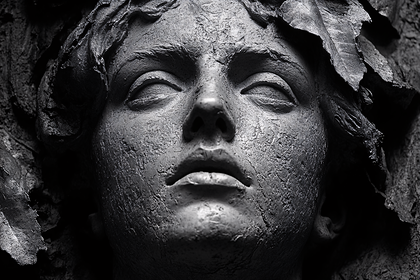 Stone Face Statue Detail