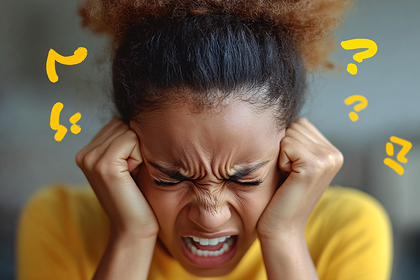 Stressed Woman Covering Ears with Question Marks