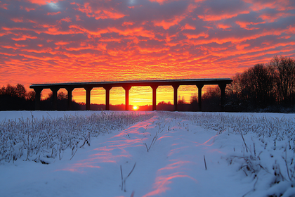 Sunset Over Snowy Bridge