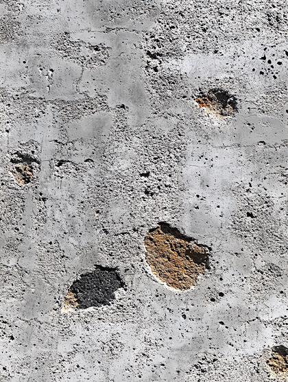 Textured Concrete Wall with Patches