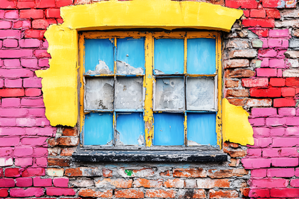 Weathered Window in Colorful Brick Wall