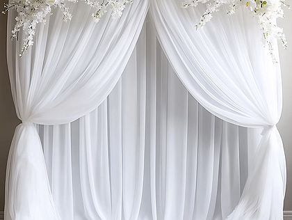 Wedding Backdrop with White Drapery and Floral Arrangement