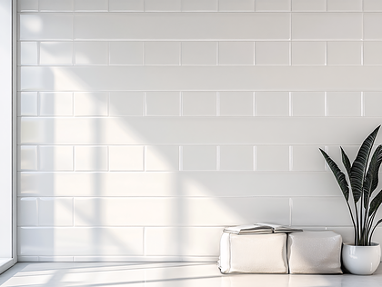 White Tiled Wall With Plant and Books
