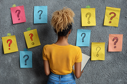 Woman Contemplating Question Marks