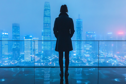 Woman Gazing at City Skyline