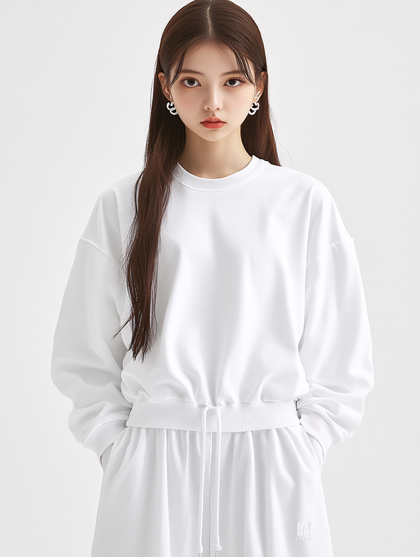Woman in White Sweatshirt Posing