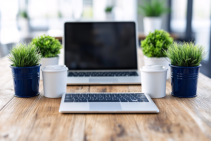 Workspace with Laptop, Plants, and Coffee