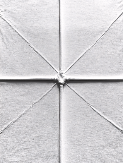 Wrinkled White Fabric Cross