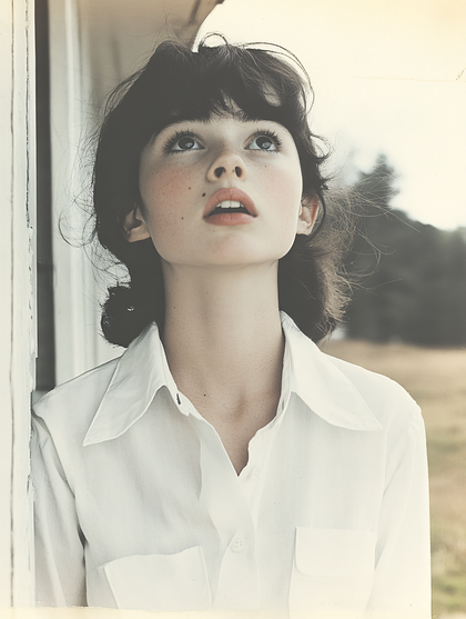 Young Woman Looking Upward in Thought